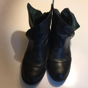Black leather boots with green suede inside